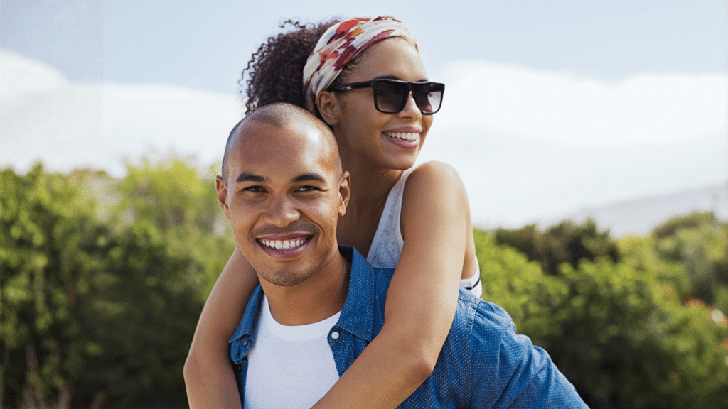 Smiling adult couple outdoors for orthodontic care at Bernhardt & Smith Orthodontics, Bishop Drive Office and 50th Street Office in West Des Moines, IA