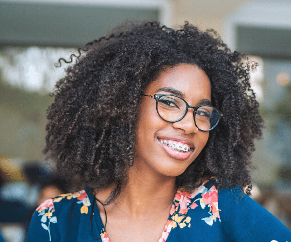 Smiling patient wearing braces at Bernhardt & Smith Orthodontics, Bishop Drive Office and 50th Street Office in West Des Moines, IA