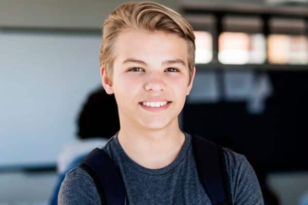 Smiling teen patient for teen orthodontic treatment at Bernhardt & Smith Orthodontics, Bishop Drive Office and 50th Street Office in West Des Moines, IA