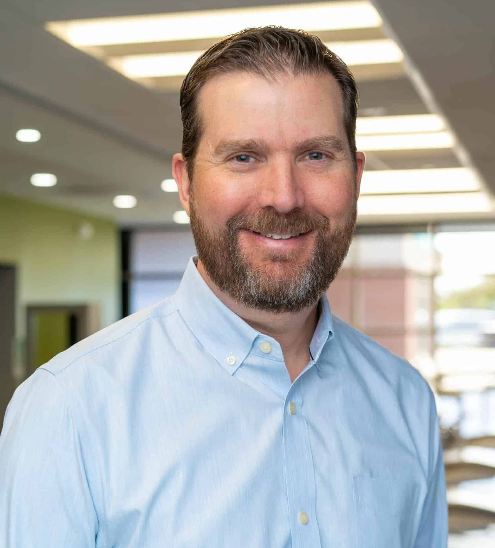 Dr. Blair Smith smiling in the orthodontic office at Bernhardt & Smith Orthodontics, Bishop Drive Office and 50th Street Office in West Des Moines, IA