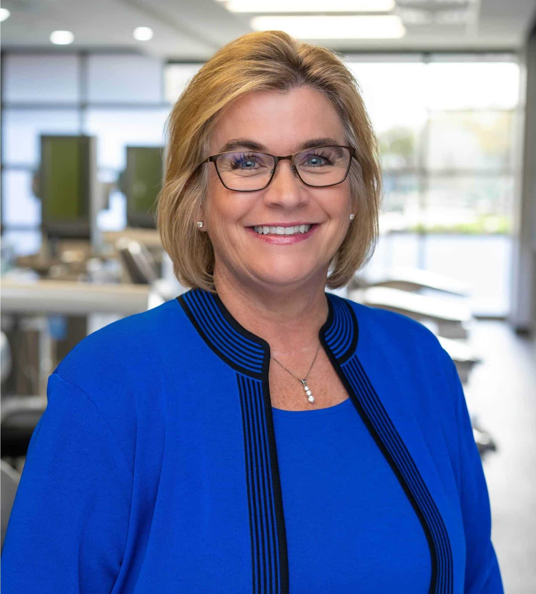 Dr. Melissa Bernhardt smiling in the orthodontic office at Bernhardt & Smith Orthodontics, Bishop Drive Office and 50th Street Office in West Des Moines, IA