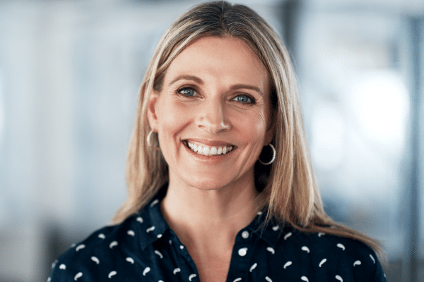 Smiling adult patient for adult orthodontic treatment at Bernhardt & Smith Orthodontics, Bishop Drive Office and 50th Street Office in West Des Moines, IA